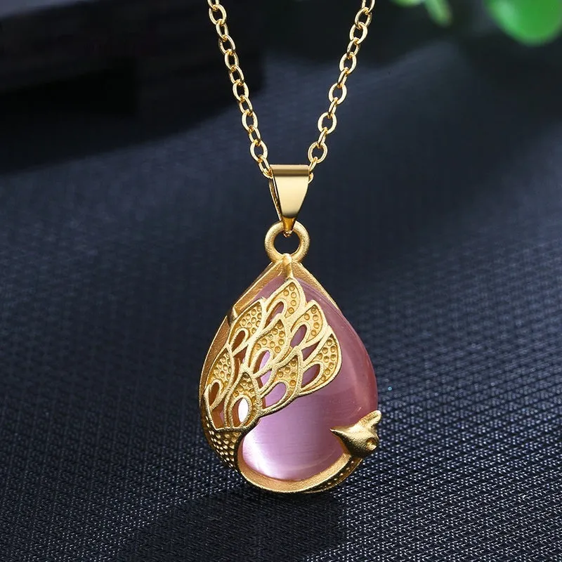 Green chalcedony imitation crystal peacock pendant on copper electroplated frame, single pendant style without chain, simple fu character design