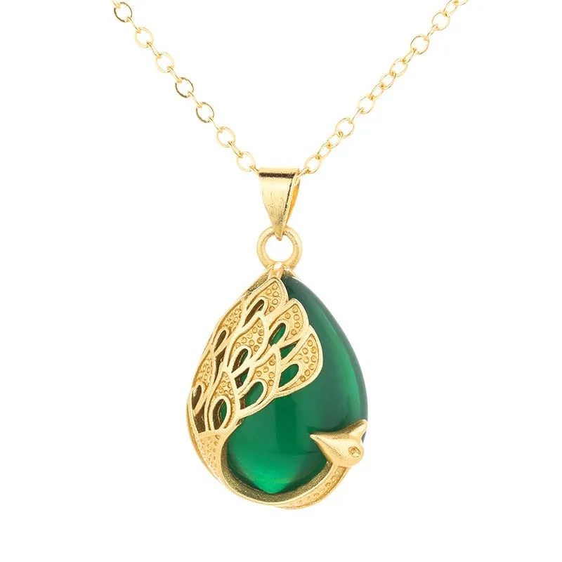 Green chalcedony imitation crystal peacock pendant on copper electroplated frame, single pendant style without chain, simple fu character design
