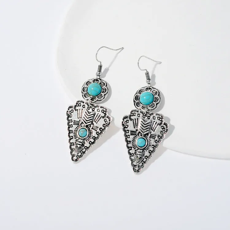 Pair of retro alloy earrings for women in triangle style with national design for travel and photo outfits.
