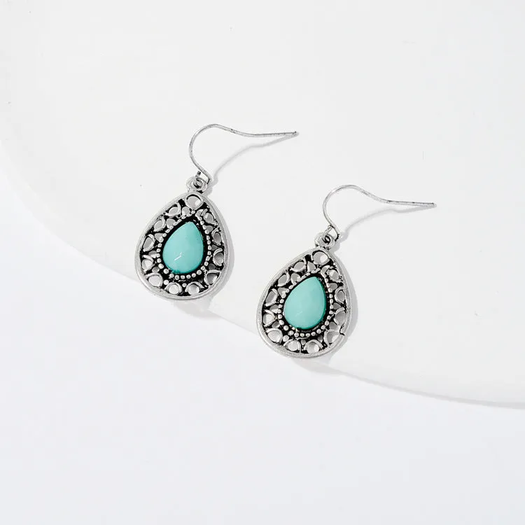 Pair of retro alloy earrings for women in triangle style with national design for travel and photo outfits.