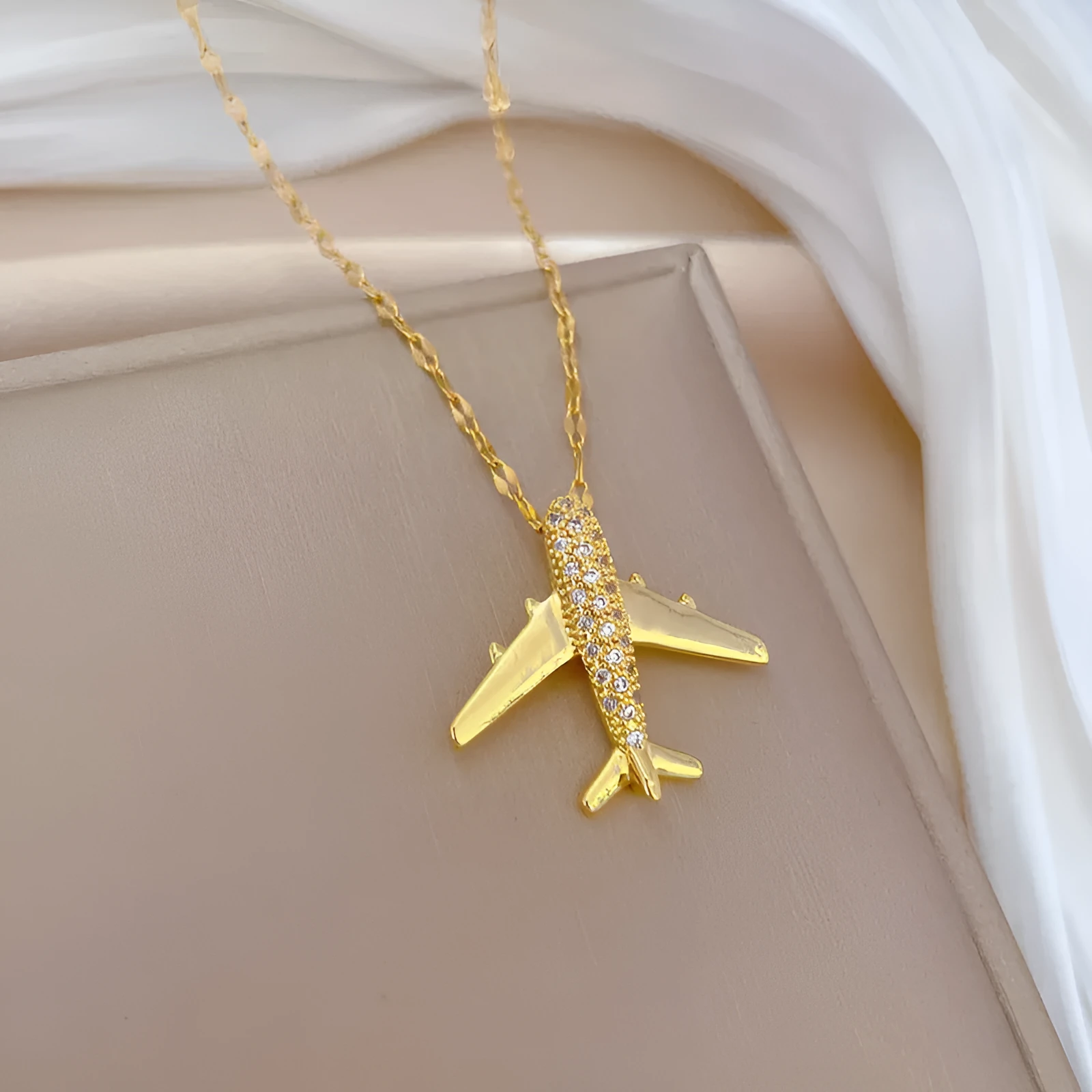 Gold geometric copper pendant necklace on adjustable stainless steel chain