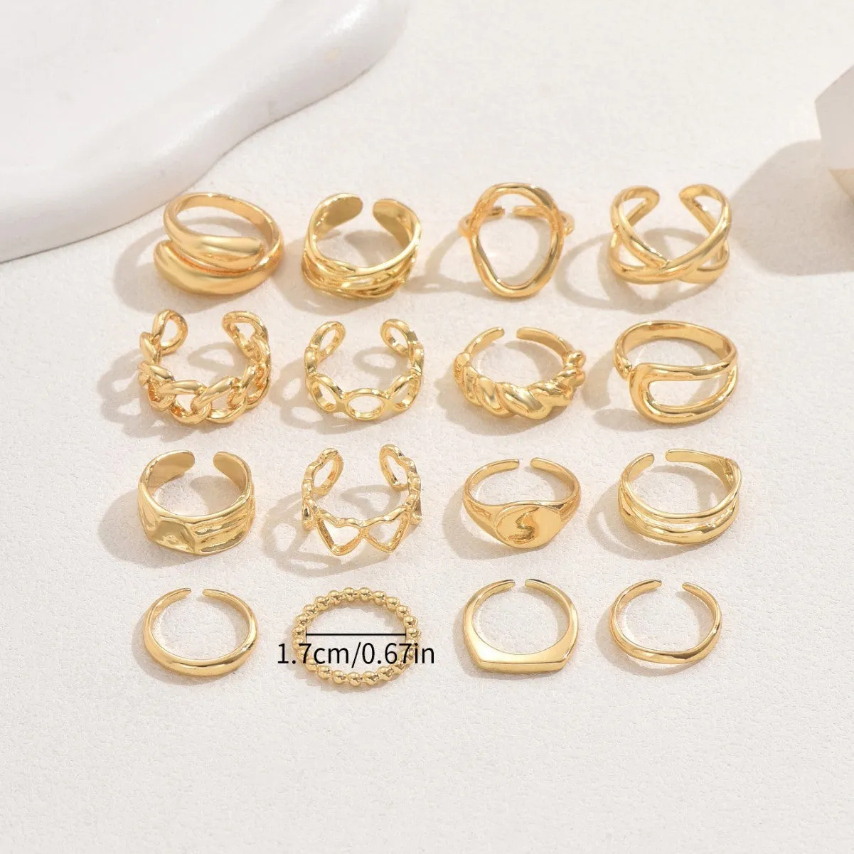 Women's 16-piece open ring suit in silver and gold zinc alloy geometric shape on display