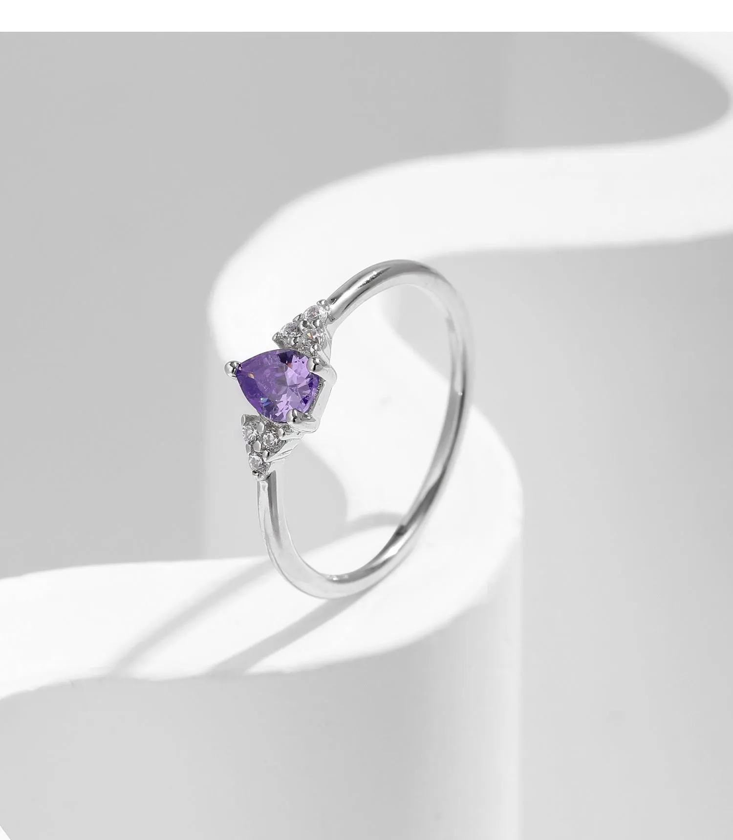 S925 sterling silver ring with purple crystal drop-shaped rhinestone on white background