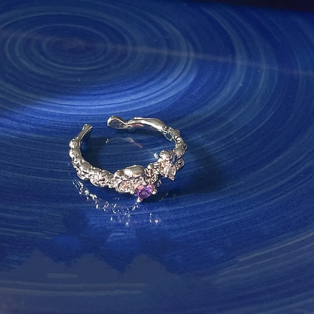 Open mouth ring in lava purple diamond colour, zinc alloy construction, geometric shape with dot detail, adjustable fit.