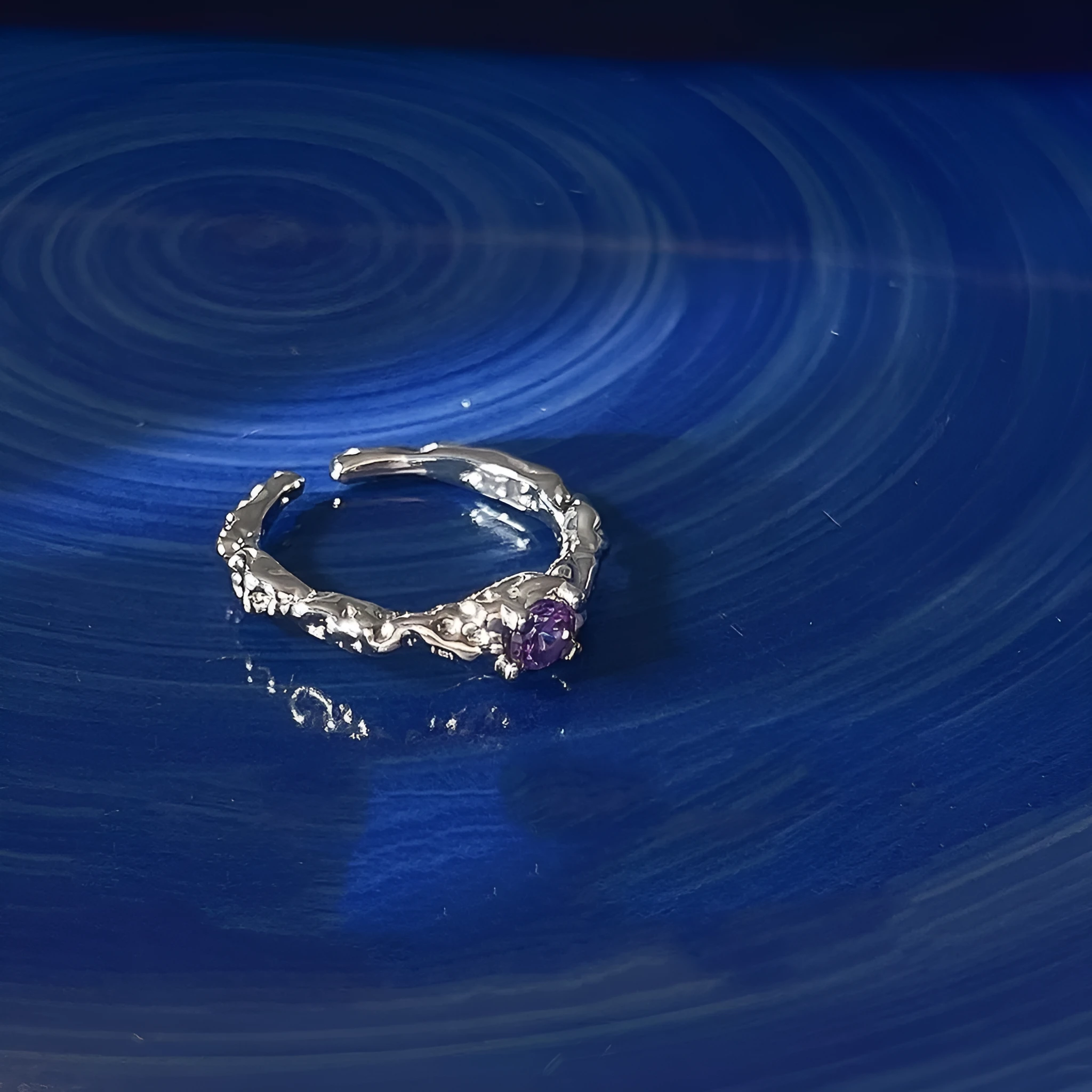 Open mouth ring in lava purple diamond colour, zinc alloy construction, geometric shape with dot detail, adjustable fit.