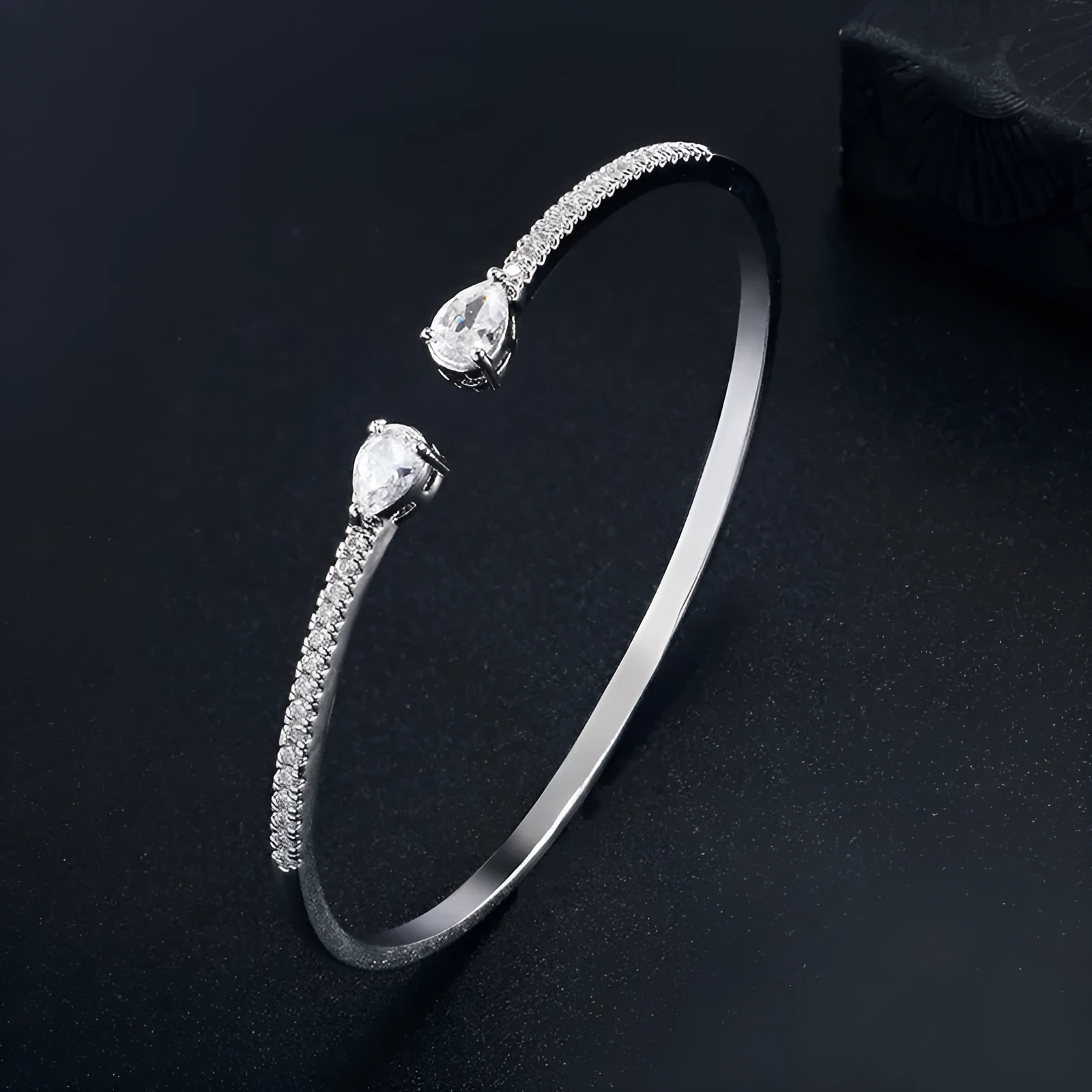 Copper multi-zircon bracelet with simple style in white colour option showing inlaid zircon treatment
