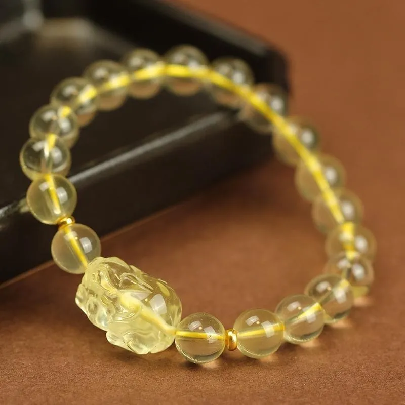 Yellow leather Pi Xiu bracelet with artificial crystal beads in Chinese simple style