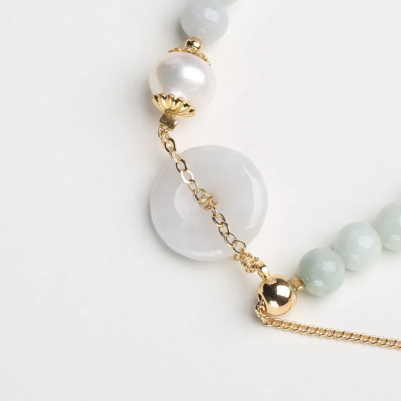Handcrafted jade pearl bracelet with peace buckle closure in traditional Chinese style