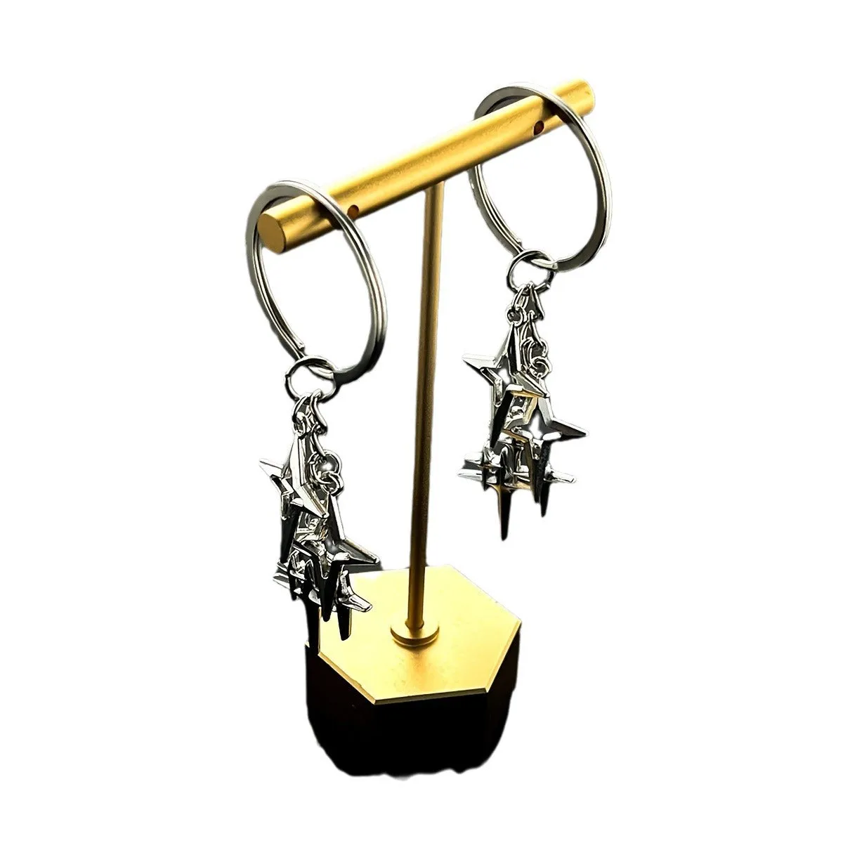 Retro metal alloy keychain with four eight-pointed stars in Q53 colour