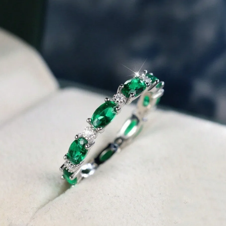 Copper ring with green and white zircon inlay geometric design on finger