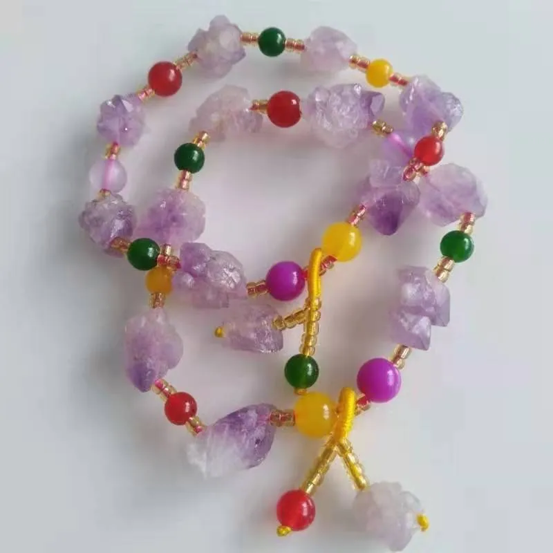 Natural shaped purple amethyst bead bracelet for women with a fu character charm.