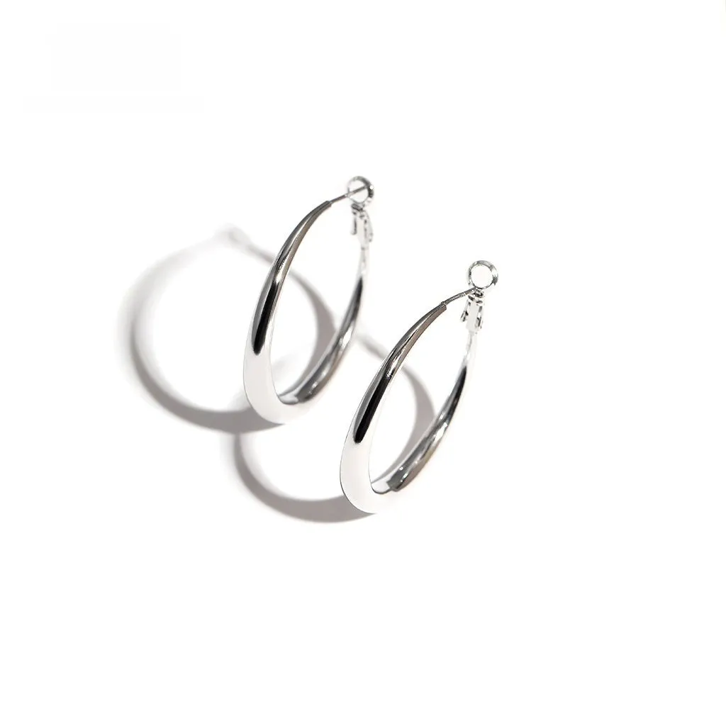 Silver needle big circle bracelet and earrings set with electroplated platinum finish on light background, three size options