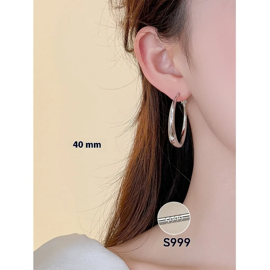 Silver needle big circle bracelet and earrings set with electroplated platinum finish on light background, three size options