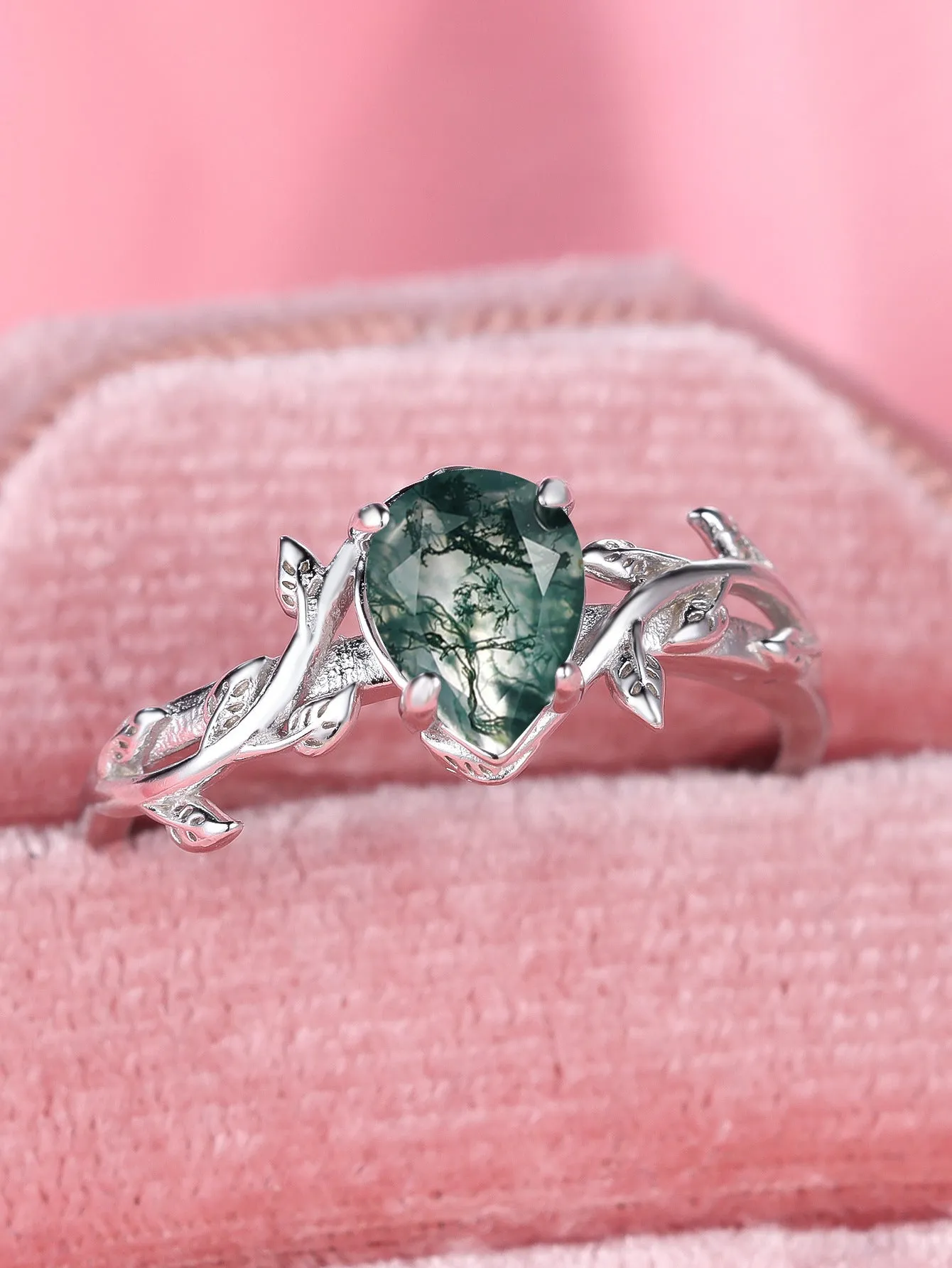 S925 silver drop-shaped agate edge branch leaf ring on white background, sterling silver band with natural stone