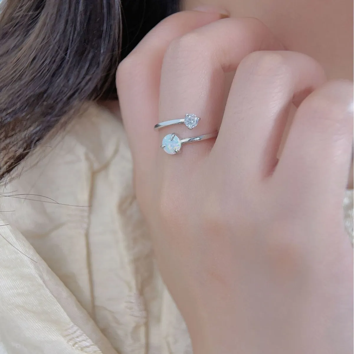 Open ring with adjustable opening, silver band, and inlaid zircon stones in gold colour