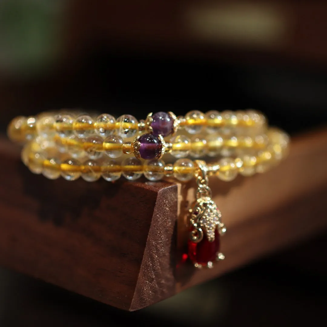 Natural Brazilian rutilated quartz bracelet with Chinese style three gold rings and hanging chopsticks design