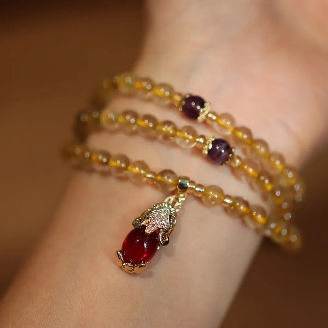 Natural Brazilian rutilated quartz bracelet with Chinese style three gold rings and hanging chopsticks design