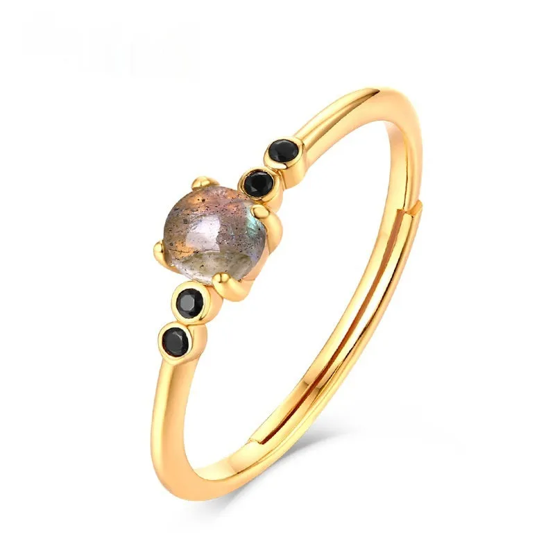 Gold coloured open ring with geometric round shape on silver base with electroplating