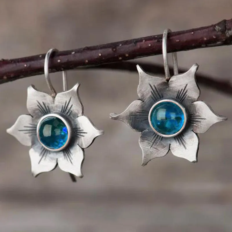 Coloured glaze electroplated metal earrings for women, silver colour, one pair shown on white background