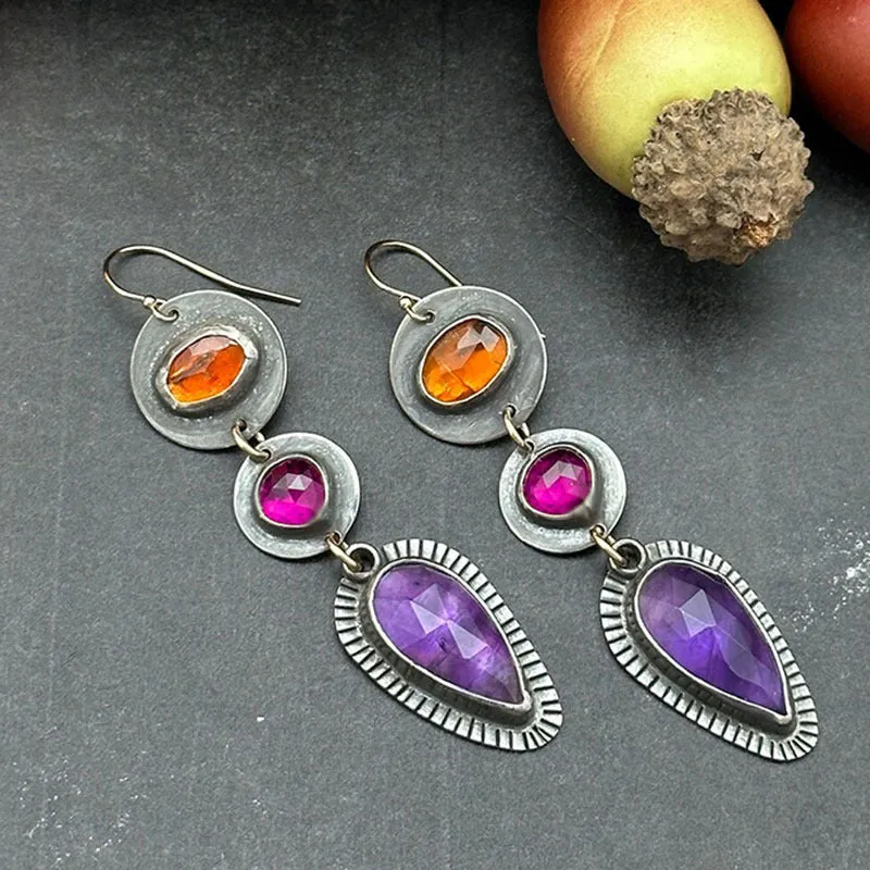 Coloured glaze electroplated metal earrings for women, silver colour, one pair shown on white background