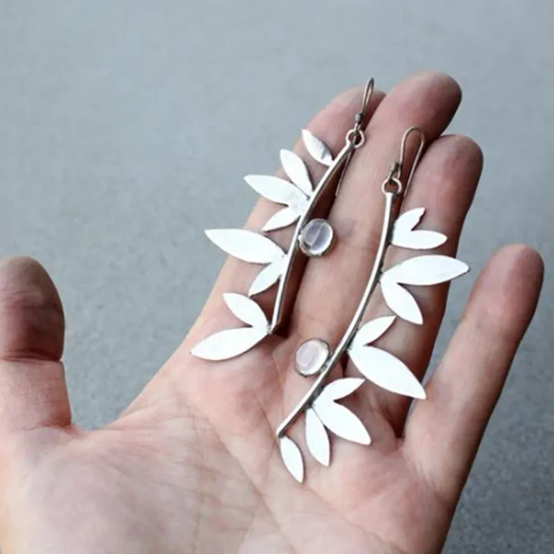 Coloured glaze electroplated metal earrings for women, silver colour, one pair shown on white background