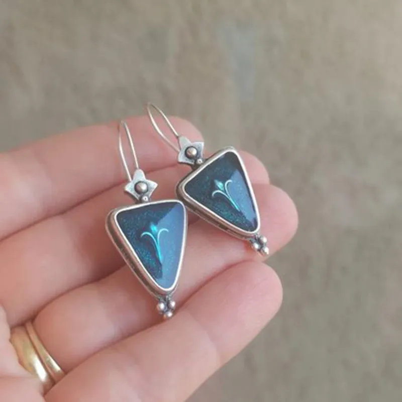 Coloured glaze electroplated metal earrings for women, silver colour, one pair shown on white background