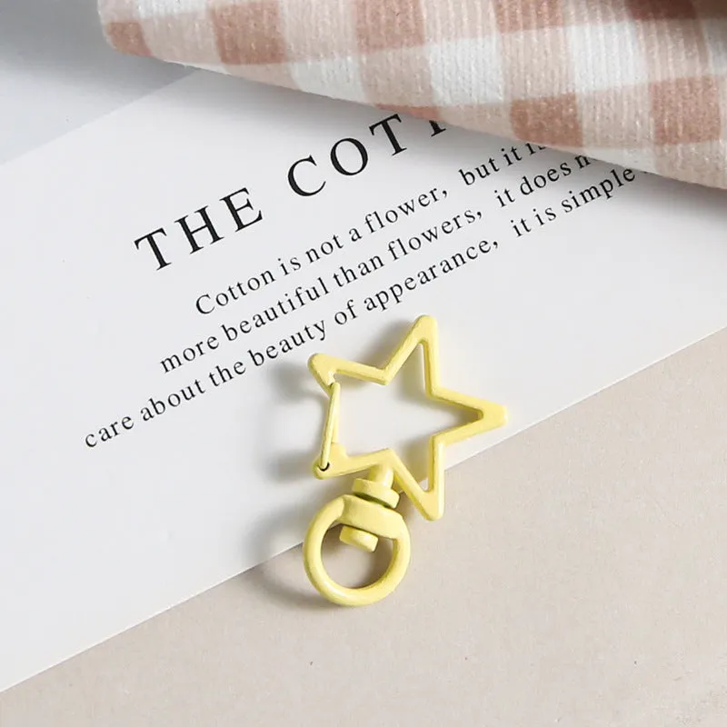 Metal five-pointed star snap button keychain with colour paint finish in alloy, small size, thirteen colour options including beige and sapphire blue