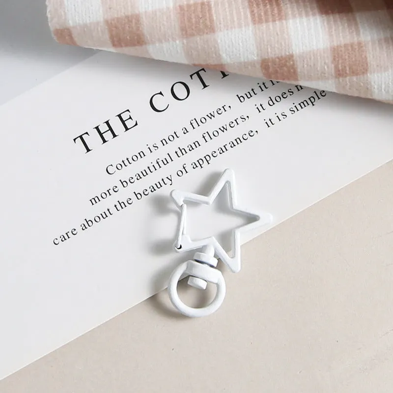 Metal five-pointed star snap button keychain with colour paint finish in alloy, small size, thirteen colour options including beige and sapphire blue