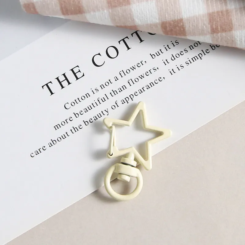 Metal five-pointed star snap button keychain with colour paint finish in alloy, small size, thirteen colour options including beige and sapphire blue