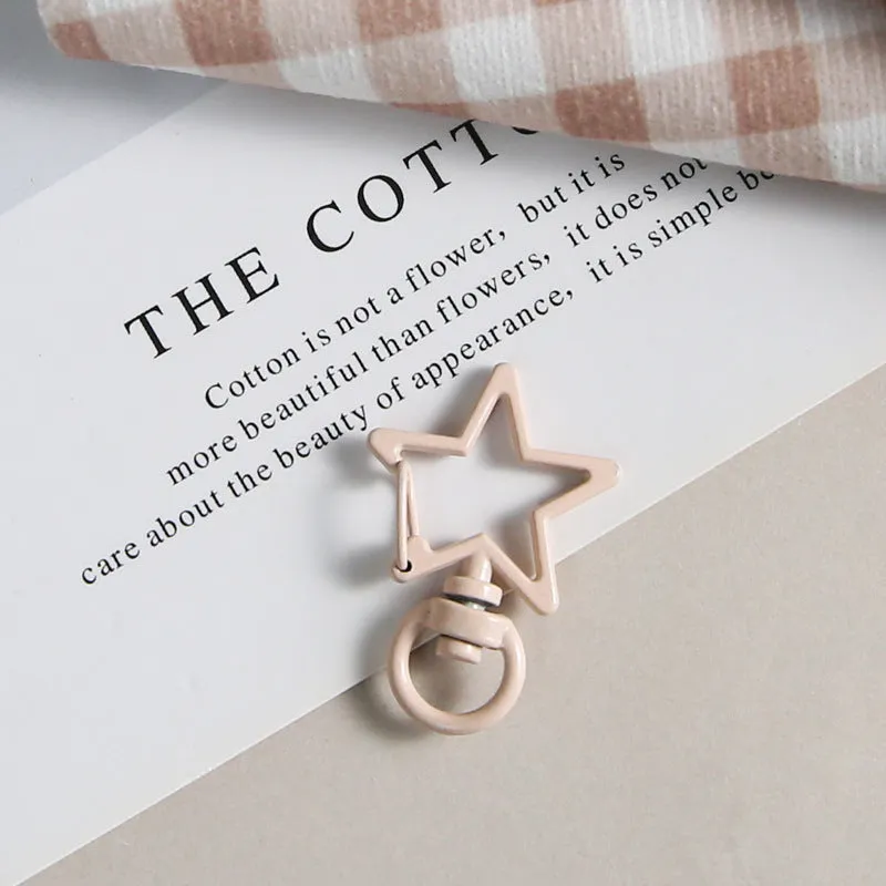 Metal five-pointed star snap button keychain with colour paint finish in alloy, small size, thirteen colour options including beige and sapphire blue