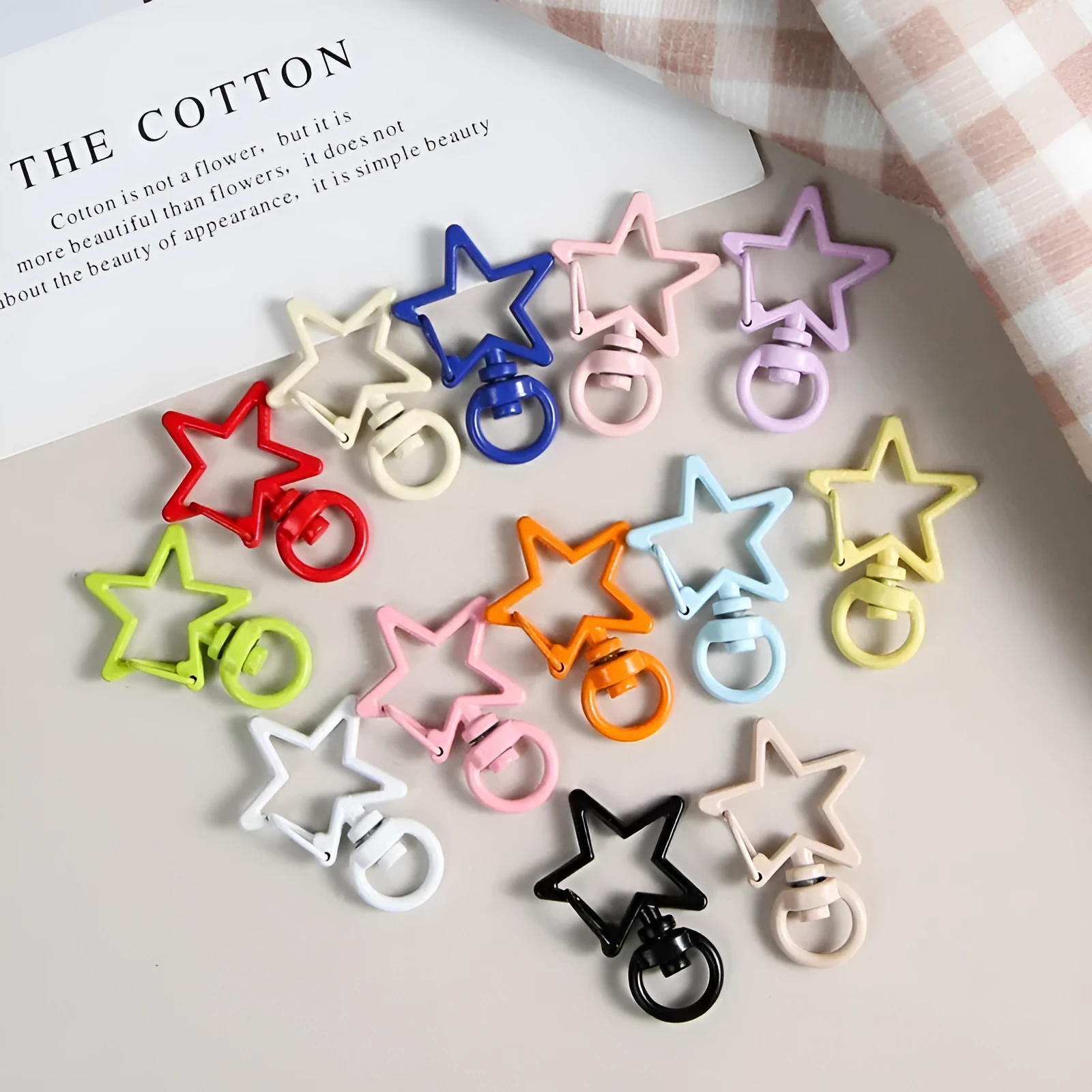 Metal five-pointed star snap button keychain with colour paint finish in alloy, small size, thirteen colour options including beige and sapphire blue