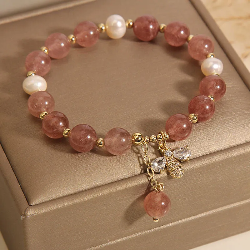 Women's bracelet with strawberry quartz beads, freshwater pearls, and zircon crystals on gold-tone clasp