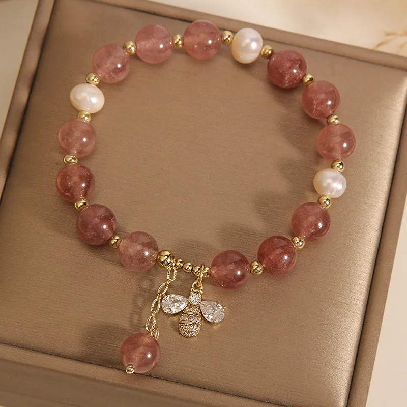 Women's bracelet with strawberry quartz beads, freshwater pearls, and zircon crystals on gold-tone clasp