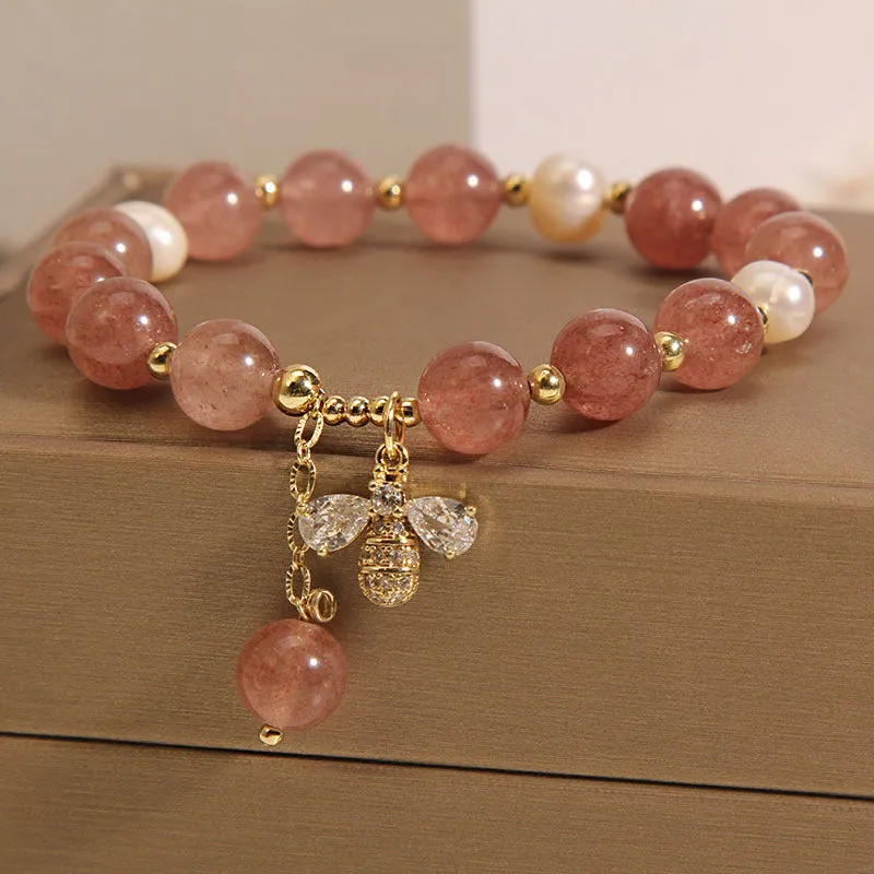 Women's bracelet with strawberry quartz beads, freshwater pearls, and zircon crystals on gold-tone clasp