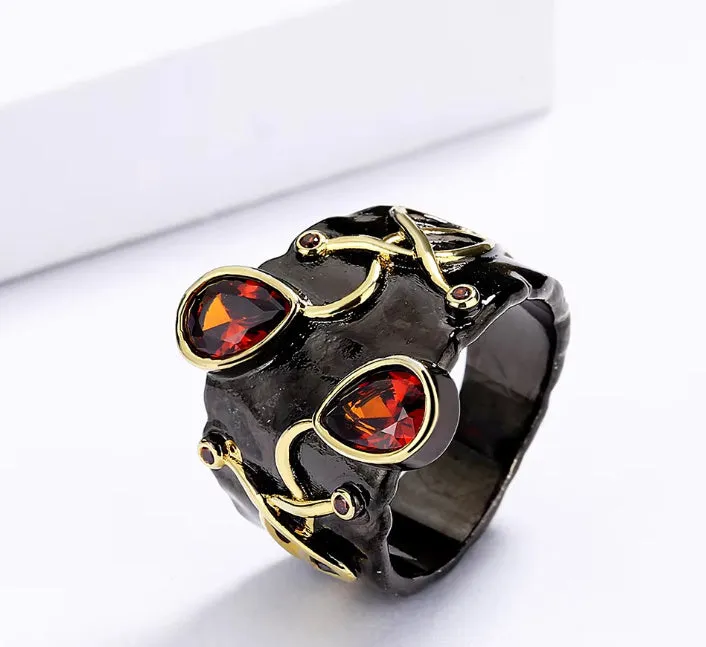 Retro women's brass oval ring in black finish on white background