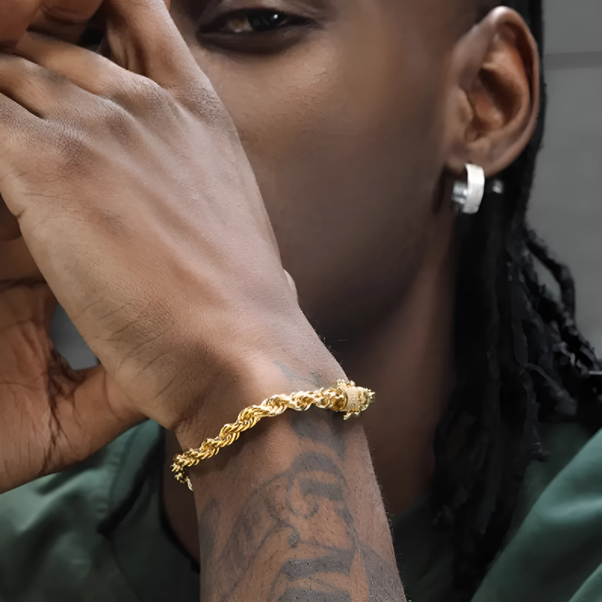 18K gold twist bracelet on a neutral background showing metallic finish and twist texture, three lengths available