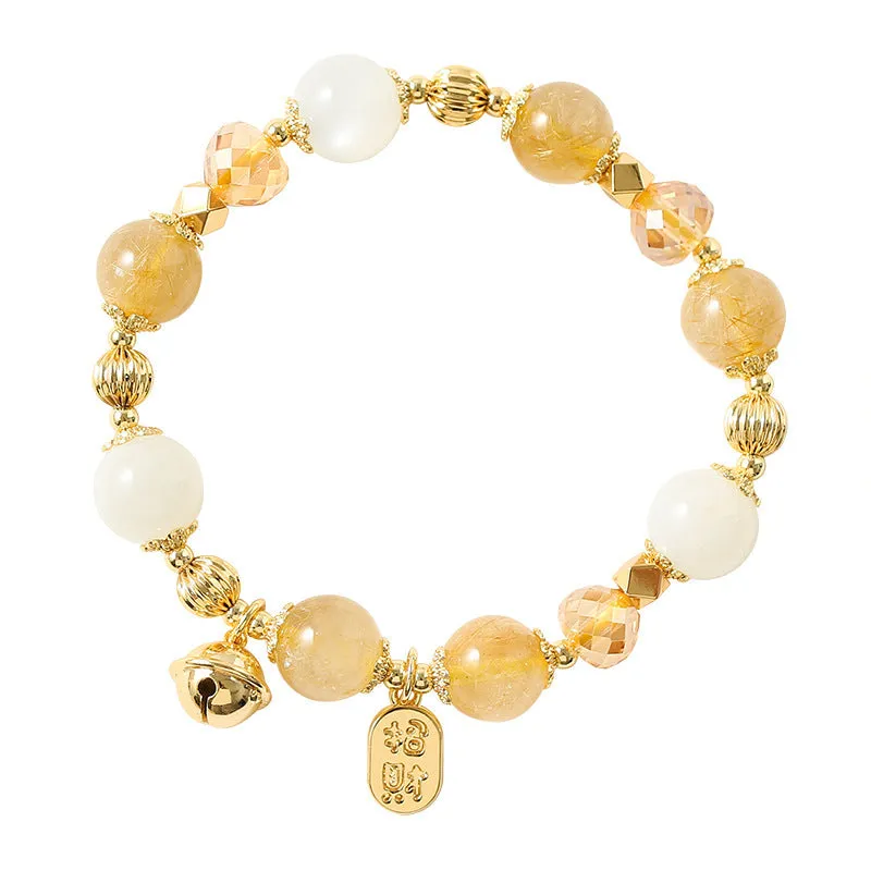 Adjustable gold tone bracelet with rutilated quartz crystal centrepiece and electroplated metal components