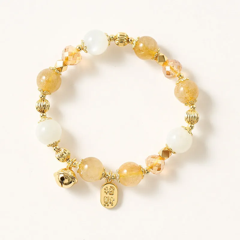Adjustable gold tone bracelet with rutilated quartz crystal centrepiece and electroplated metal components