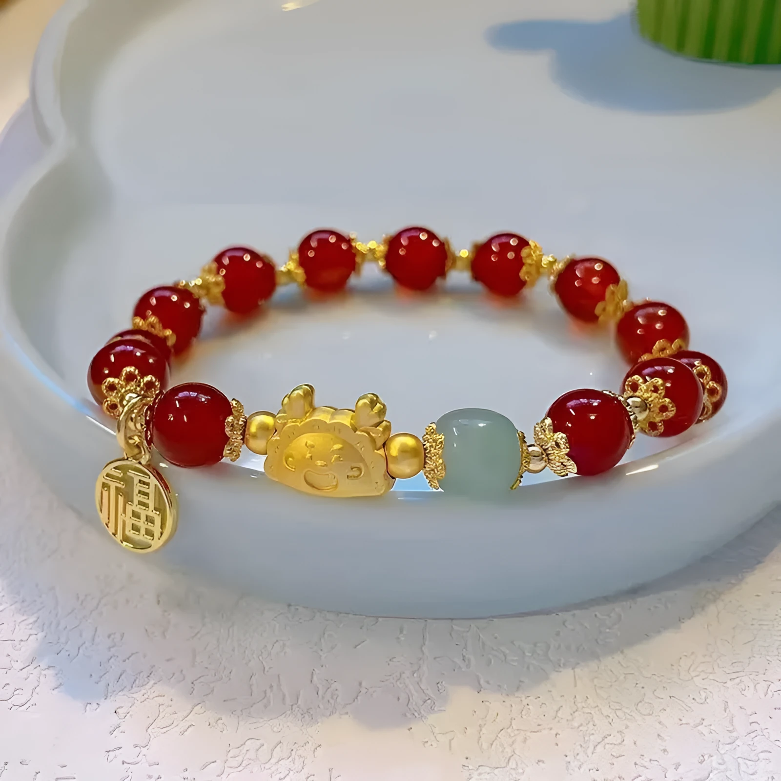 Women's floral glazed bracelet with animal zodiac motifs on coloured glass beads in red, pink, and white variants