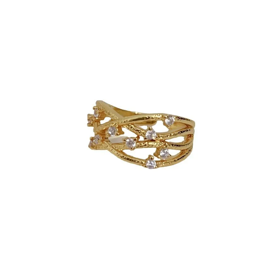 Women's adjustable copper ring with three-dimensional hollow vine cord design in gold electroplated finish