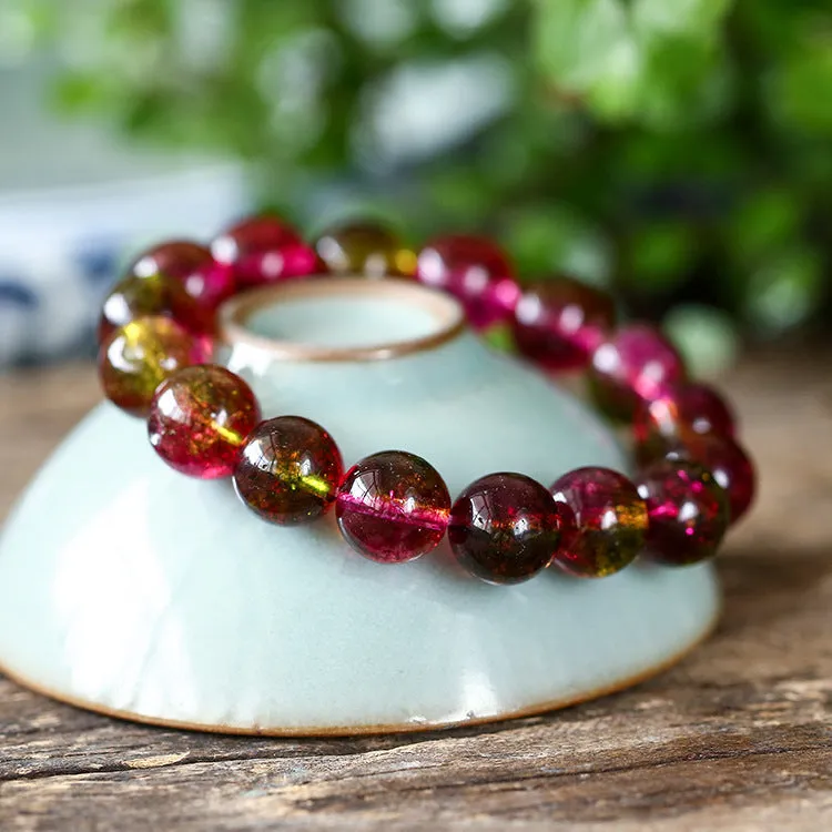Close-up of a handmade pastel pink and green watermelon crystal bracelet for women, showing bead detail.