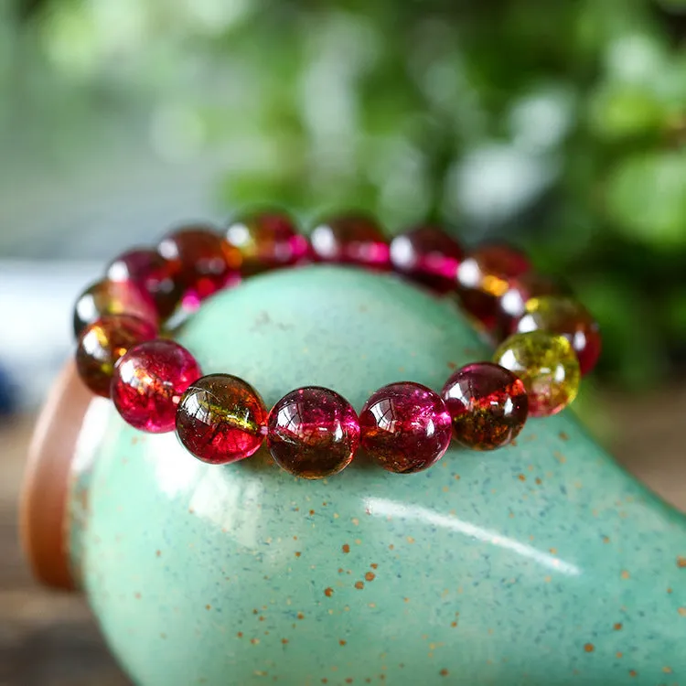 Close-up of a handmade pastel pink and green watermelon crystal bracelet for women, showing bead detail.