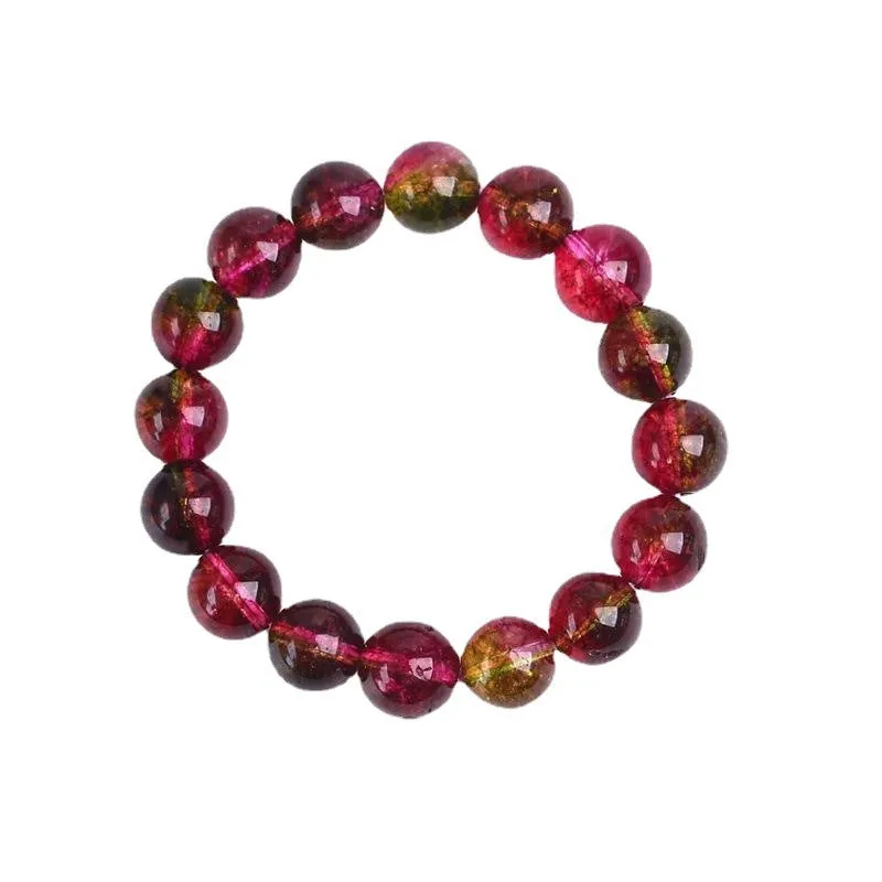 Close-up of a handmade pastel pink and green watermelon crystal bracelet for women, showing bead detail.
