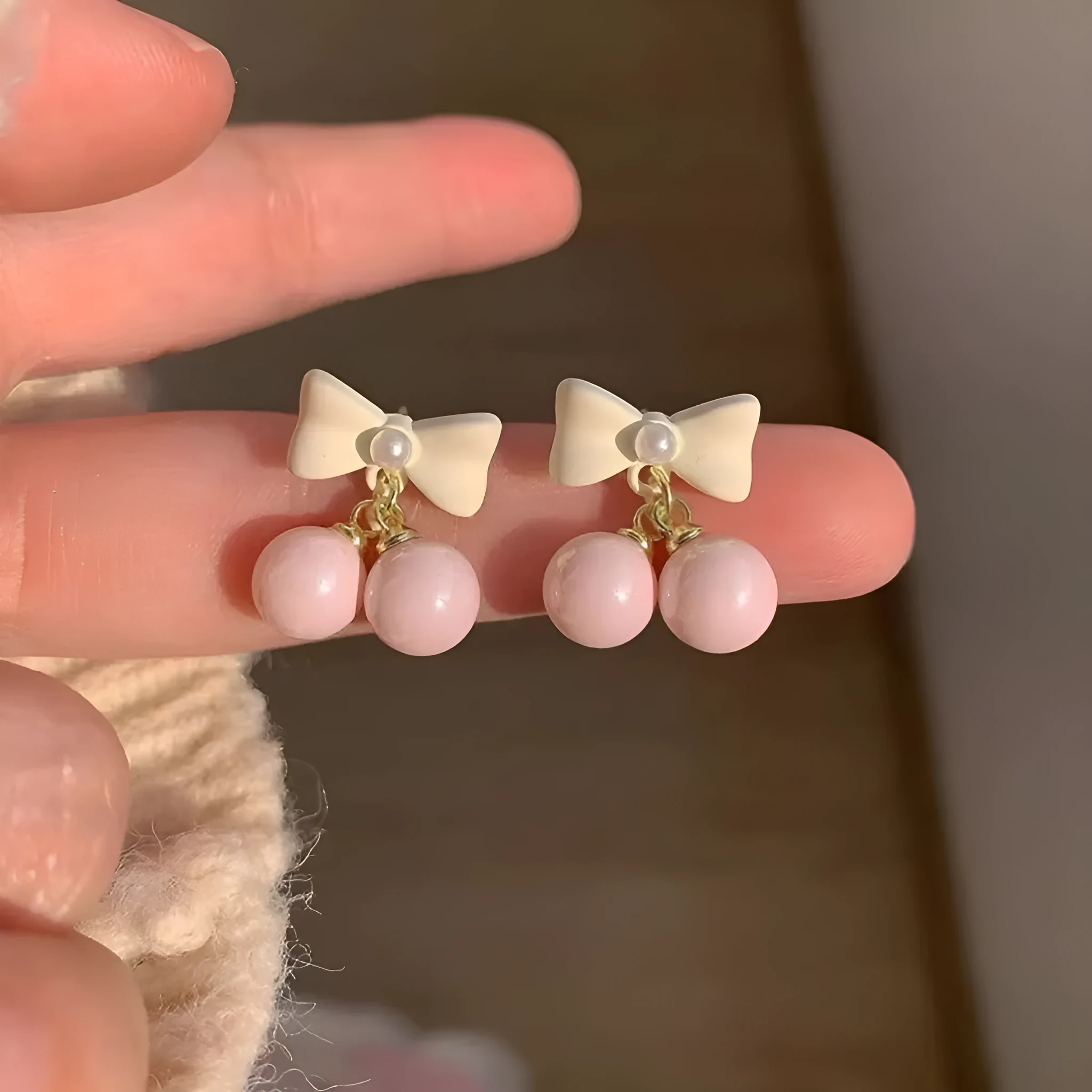 Pink heart pearl bow earrings on alloy with electroplated finish, silver needle style