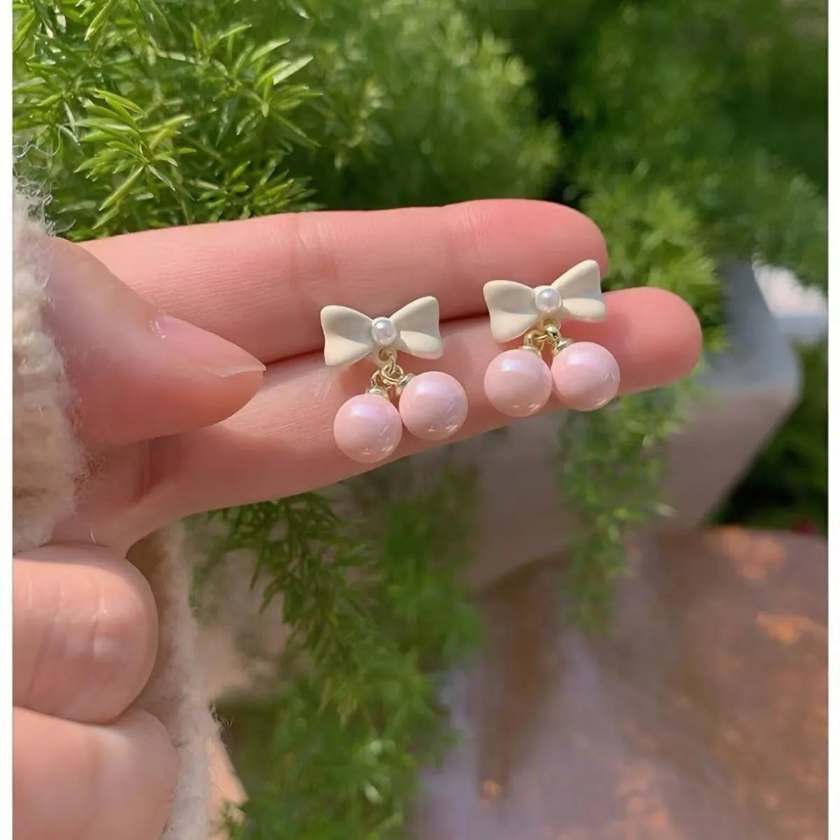 Pink heart pearl bow earrings on alloy with electroplated finish, silver needle style