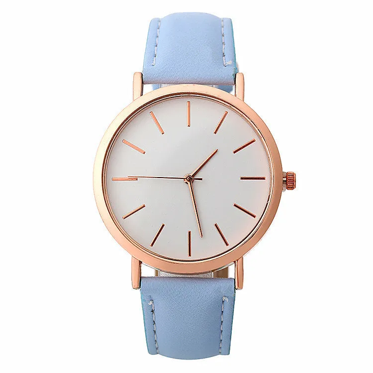 Women's quartz wristwatch round dial 28mm thin case beige strap on white background