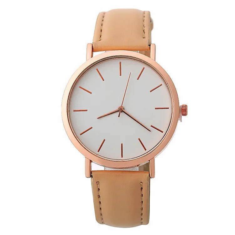 Women's quartz wristwatch round dial 28mm thin case beige strap on white background