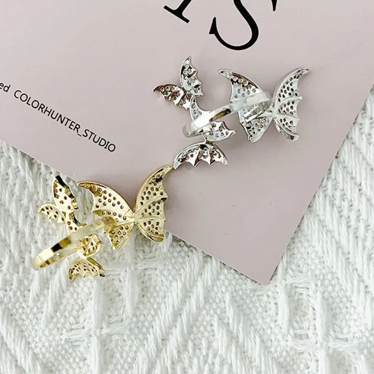 Turnable anxiety ring with bead in rose gold finish, copper construction, adjustable opening, butterfly motif