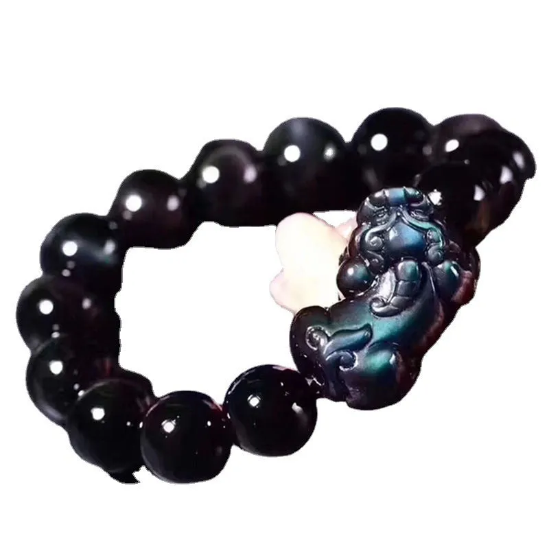 Natural ice colour eye obsidian crystal bracelet with spherical beads on a string.