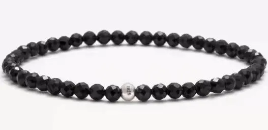 Geometric unisex bracelet with 4mm black agate, blue san, and obsidian beads on a wrist.